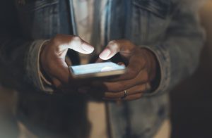 man using an electronic device